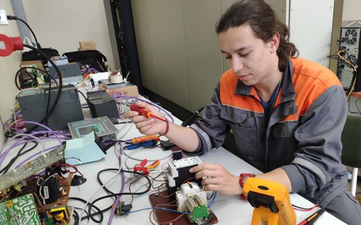 male apprentice working with different tools