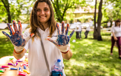 Girl with paint on her hands