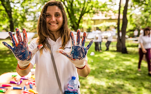 Girl with paint on her hands